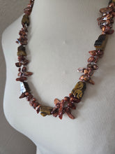 Bronze blister freshwater pearls and carved tigers eye. 24"
