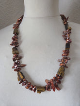Bronze blister freshwater pearls and carved tigers eye. 24"