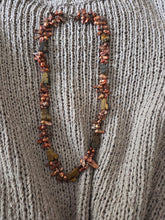 Bronze blister freshwater pearls and carved tigers eye. 24"