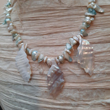 Freshwater keishi and blister pearls and mother of pearl necklace.