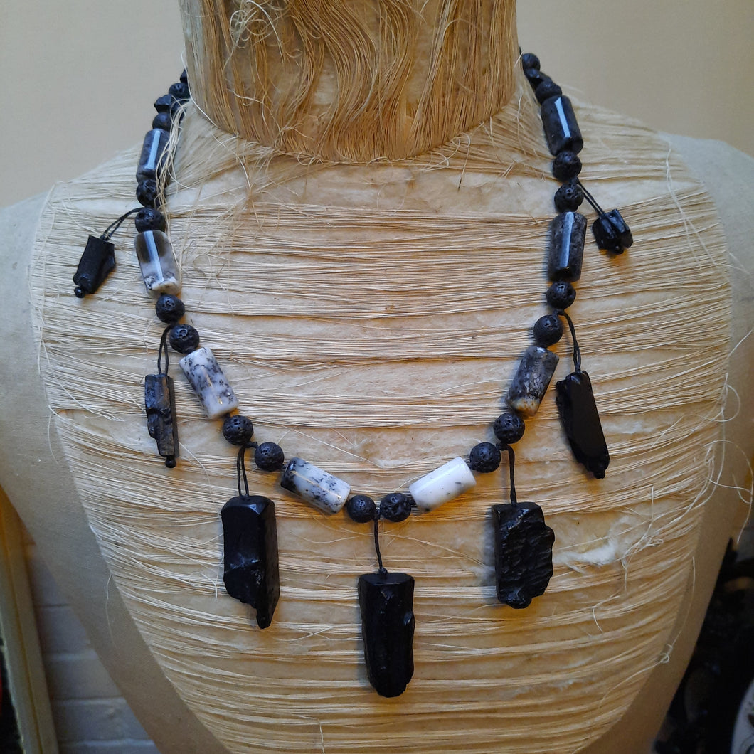 Rutile quartz, black rock and resin necklace.